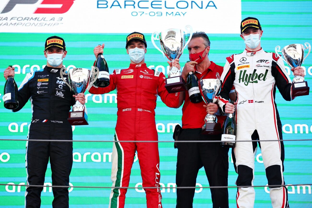 BARCELONA, SPAIN - MAY 08: Race winner Olli Caldwell of Great Britain and Prema Racing, second placed Victor Martins of France and MP Motorsport  and third placed Frederik Vesti of Denmark and ART Grand Prix celebrate on the podium during race 2 of Round 1:Barcelona of the Formula 3 Championship at Circuit de Barcelona-Catalunya on May 08, 2021 in Barcelona, Spain. (Photo by Joe Portlock - Formula 1/Formula Motorsport Limited via Getty Images)