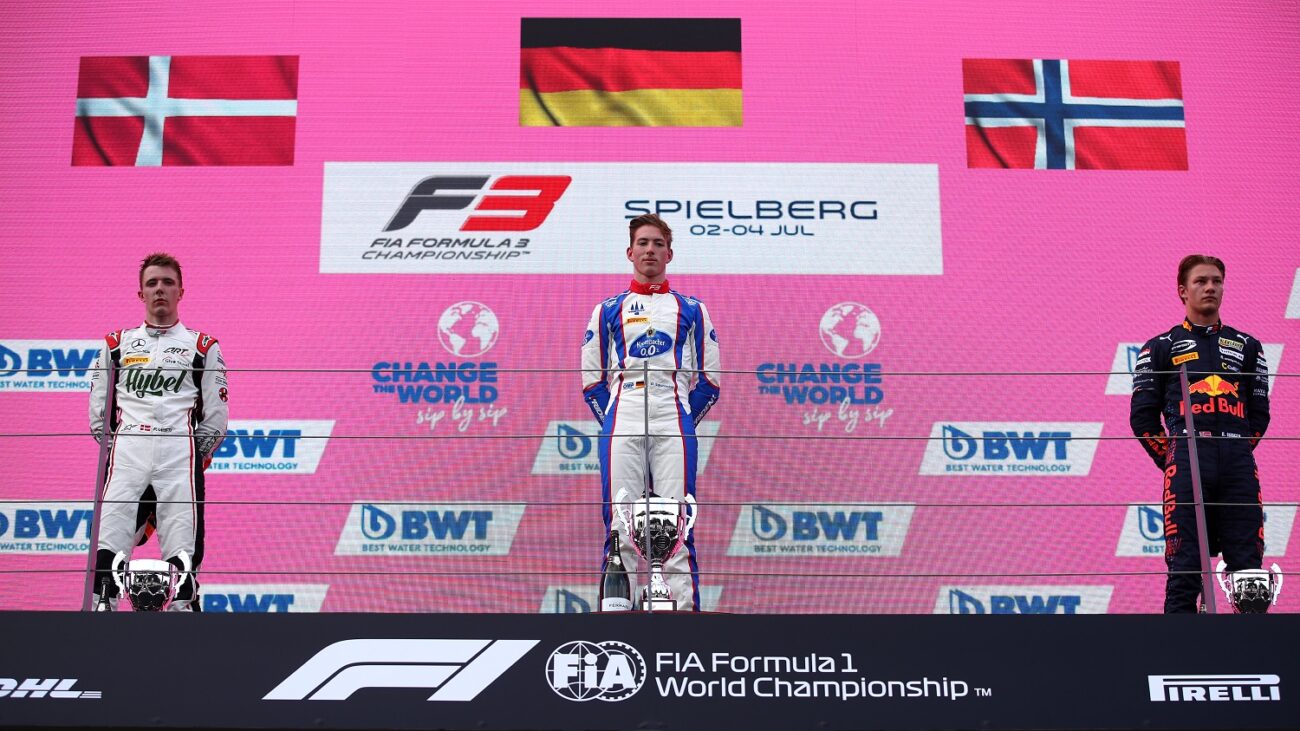 SPIELBERG, AUSTRIA - JULY 03: Race winner David Schumacher of Germany and Trident , second placed Frederik Vesti of Denmark and ART Grand Prix and third placed Dennis Hauger of Norway and Prema Racing celebrate on the podium during race 2 of Round 3:Spielberg of the Formula 3 Championship at Red Bull Ring on July 03, 2021 in Spielberg, Austria. (Photo by Joe Portlock - Formula 1/Formula Motorsport Limited via Getty Images)