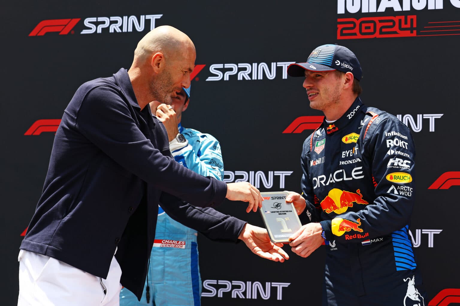 MIAMI, FLORIDA - MAY 04: Sprint winner Max Verstappen of the Netherlands and Oracle Red Bull Racing is presented with his award by Zinedine Zidane in parc ferme during the Sprint ahead of the F1 Grand Prix of Miami at Miami International Autodrome on May 04, 2024 in Miami, Florida. (Photo by Mark Thompson/Getty Images) // Getty Images / Red Bull Content Pool // SI202405040337 // Usage for editorial use only //