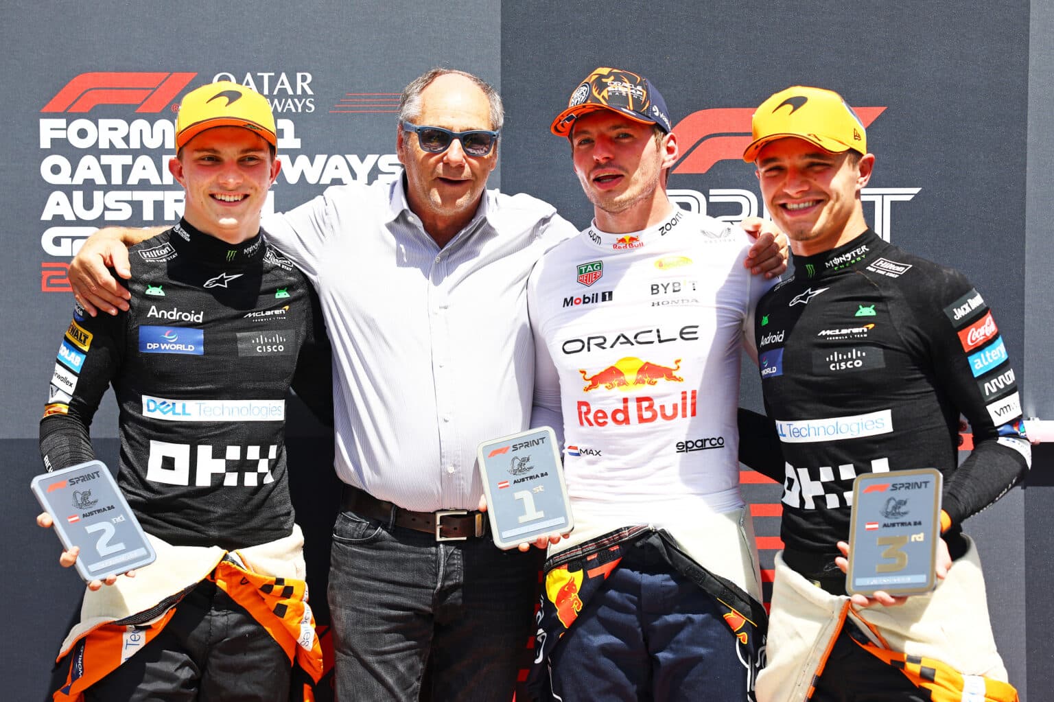 SPIELBERG, AUSTRIA - JUNE 29: Sprint winner Max Verstappen of the Netherlands and Oracle Red Bull Racing, Second placed Oscar Piastri of Australia and McLaren, Third placed Lando Norris of Great Britain and McLaren and Gerhard Berger pose for a photo in parc ferme during the Sprint ahead of the F1 Grand Prix of Austria at Red Bull Ring on June 29, 2024 in Spielberg, Austria. (Photo by Mark Thompson/Getty Images) // Getty Images / Red Bull Content Pool // SI202406290142 // Usage for editorial use only //