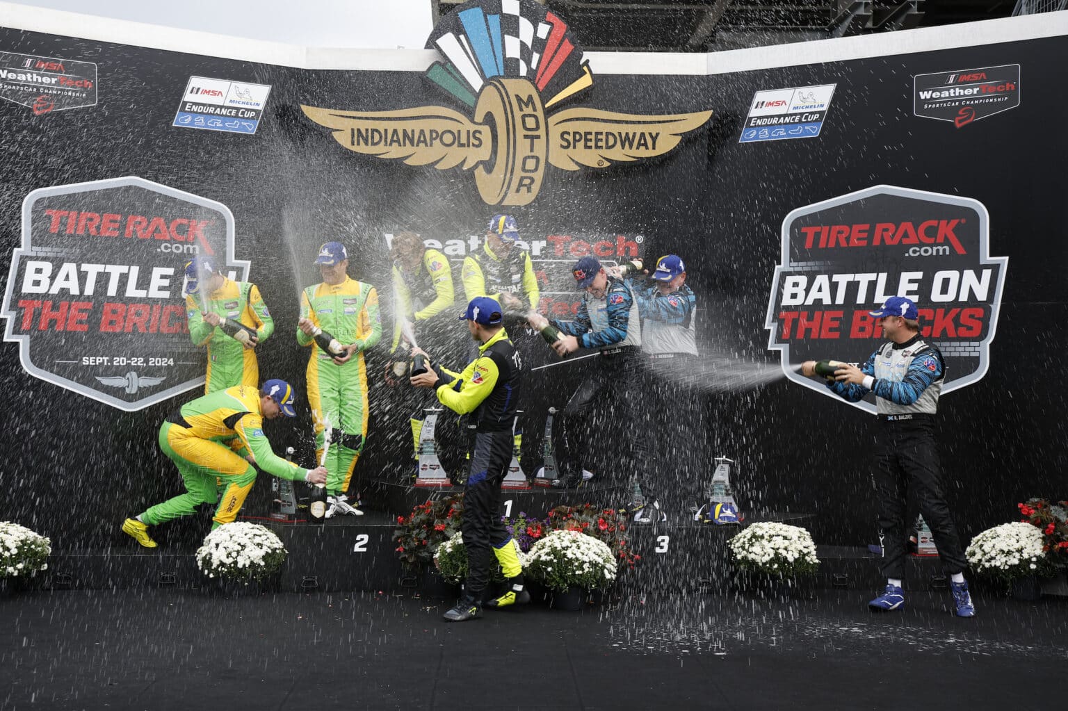 #11: TDS Racing, ORECA LMP2 07, LMP2: Mikkel Jensen, Hunter McElrea, Steven Thomas, #52: Inter Europol by PR1 Mathiasen Motorsports, ORECA LMP2 07, LMP2: Jakub Smiechowski, Nick Boulle, Tom Dillmann, #18: Era Motorsport, ORECA LMP2 07, LMP2: Dwight Merriman, Ryan Dalziel, Connor Zilisch celebrate on the podium with champagne