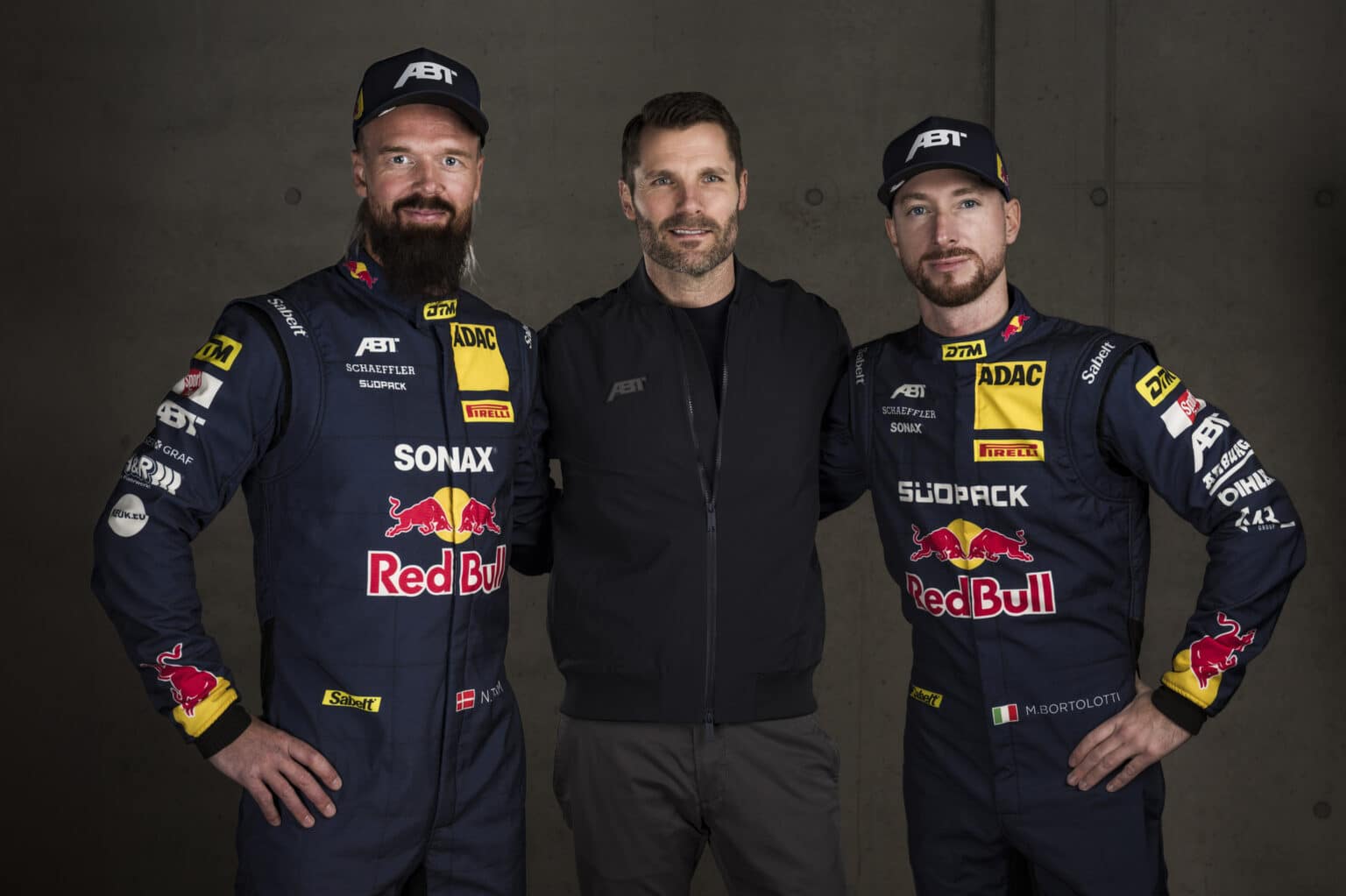 (L-R) Nicki Thiim of Denmark, Martin Tomczyk of Germany, ABT Motorsport director, and Mirko Bortolotti of Italy pose for a photograph prior to the DTM Team ABT Sportsline reveal of their cars and drivers for the 2025 season in Hochgurgl, Austria on February 17 2025.