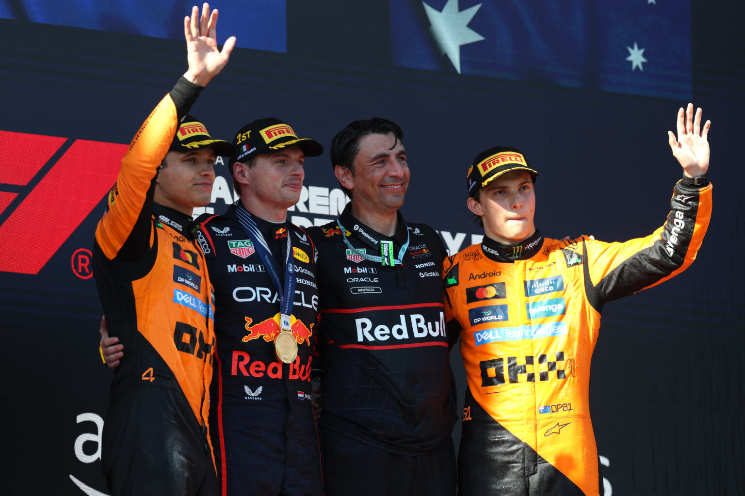 IMOLA, ITALY - MAY 18: Race winner Max Verstappen of the Netherlands and Oracle Red Bull Racing Second placed Lando Norris of Great Britain and McLaren Third placed Oscar Piastri of Australia and McLaren and Enrico Balbo, Head of Aerodynamics of Oracle Red Bull Racing on the podium during the F1 Grand Prix of Emilia-Romagna at Autodromo Internazionale Enzo e Dino Ferrari on May 18, 2025 in Imola, Italy. (Photo by Ryan Pierse/Getty Images)