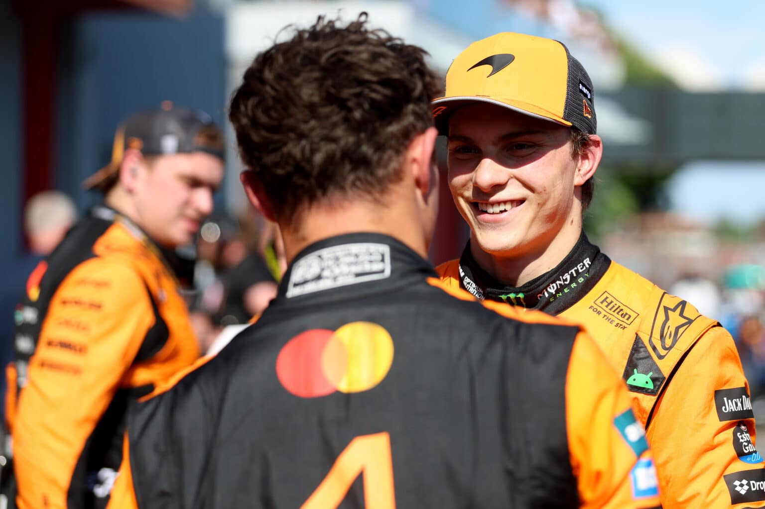 IMOLA, ITALY - MAY 18: Third placed Oscar Piastri of Australia and McLaren and Second placed Lando Norris of Great Britain and McLaren talk in parc ferme during the F1 Grand Prix of Emilia-Romagna at Autodromo Internazionale Enzo e Dino Ferrari on May 18, 2025 in Imola, Italy. (Photo by Steven Tee/LAT Images)