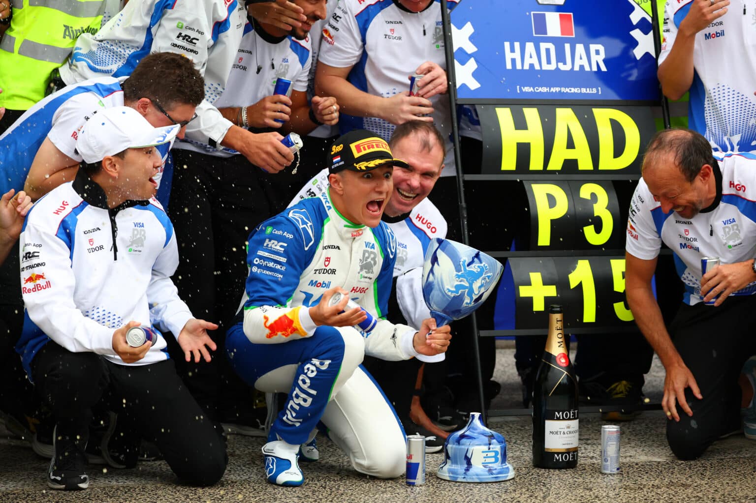 ZANDVOORT, NETHERLANDS - AUGUST 31: Third placed Isack Hadjar of France and Visa Cash App Racing Bulls Alan Permane, Team Principal of Visa Cash App Racing Bulls Peter Bayer, CEO of Visa Cash App Racing Bulls and the Visa Cash App Racing Bulls team celebrate during the F1 Grand Prix of Netherlands at Circuit Zandvoort on August 31, 2025 in Zandvoort, Netherlands. (Photo by Clive Rose/Getty Images) // Getty Images / Red Bull Content Pool // SI202508310547 // Usage for editorial use only //