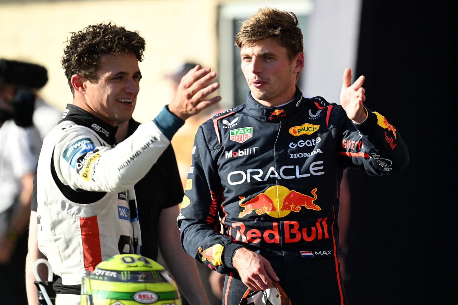 AUSTIN, TEXAS - OCTOBER 18: Pole position qualifier Max Verstappen of the Netherlands and Oracle Red Bull Racing and Second placed qualifier Lando Norris of Great Britain and McLaren talk in parc ferme during Qualifying ahead of the F1 Grand Prix of United States at Circuit of The Americas on October 18, 2025 in Austin, Texas. (Photo by Simon Galloway/LAT Images) // Getty Images / Red Bull Content Pool // SI202510190036 // Usage for editorial use only //