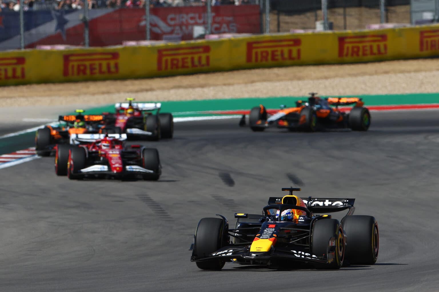 AUSTIN, TEXAS - OCTOBER 19: Max Verstappen of the Netherlands driving the (1) Oracle Red Bull Racing RB21 leads Charles Leclerc of Monaco driving the (16) Scuderia Ferrari SF-25 on track during the F1 Grand Prix of United States at Circuit of The Americas on October 19, 2025 in Austin, Texas. (Photo by Zak Mauger/LAT Images) // Getty Images / Red Bull Content Pool // SI202510191173 // Usage for editorial use only //