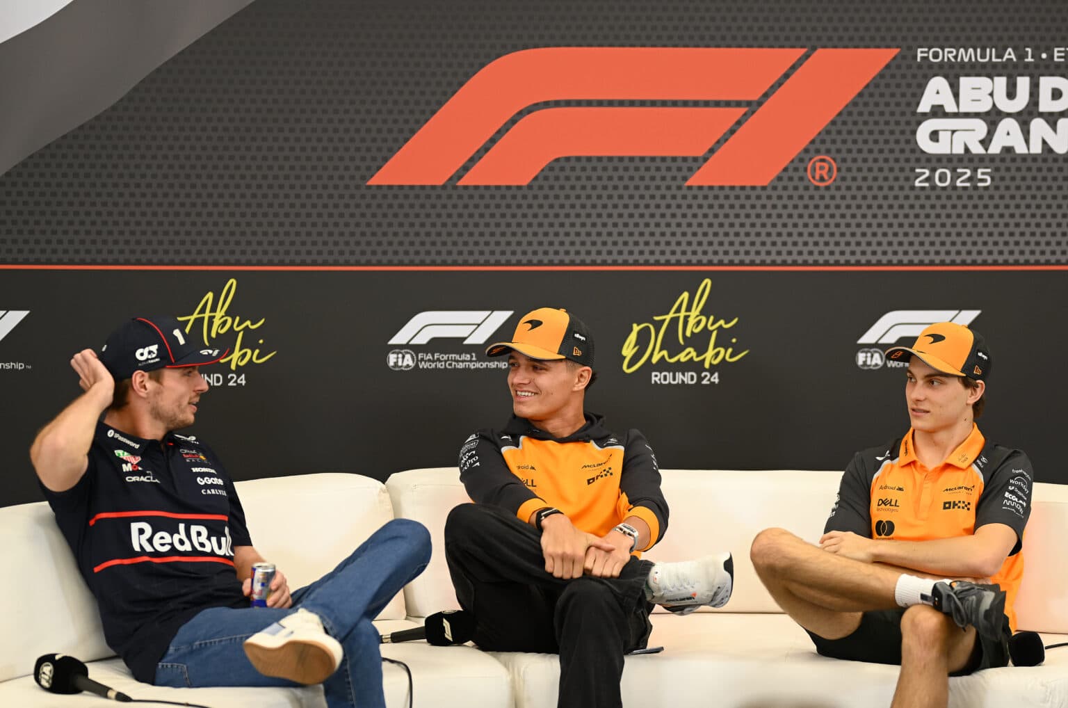 ABU DHABI, UNITED ARAB EMIRATES - DECEMBER 04: Max Verstappen of the Netherlands and Oracle Red Bull Racing, Lando Norris of Great Britain and McLaren and Oscar Piastri of Australia and McLaren attend the Drivers Press Conference during previews ahead of the F1 Grand Prix of Abu Dhabi at Yas Marina Circuit on December 04, 2025 in Abu Dhabi, United Arab Emirates. (Photo by Clive Mason/Getty Images)