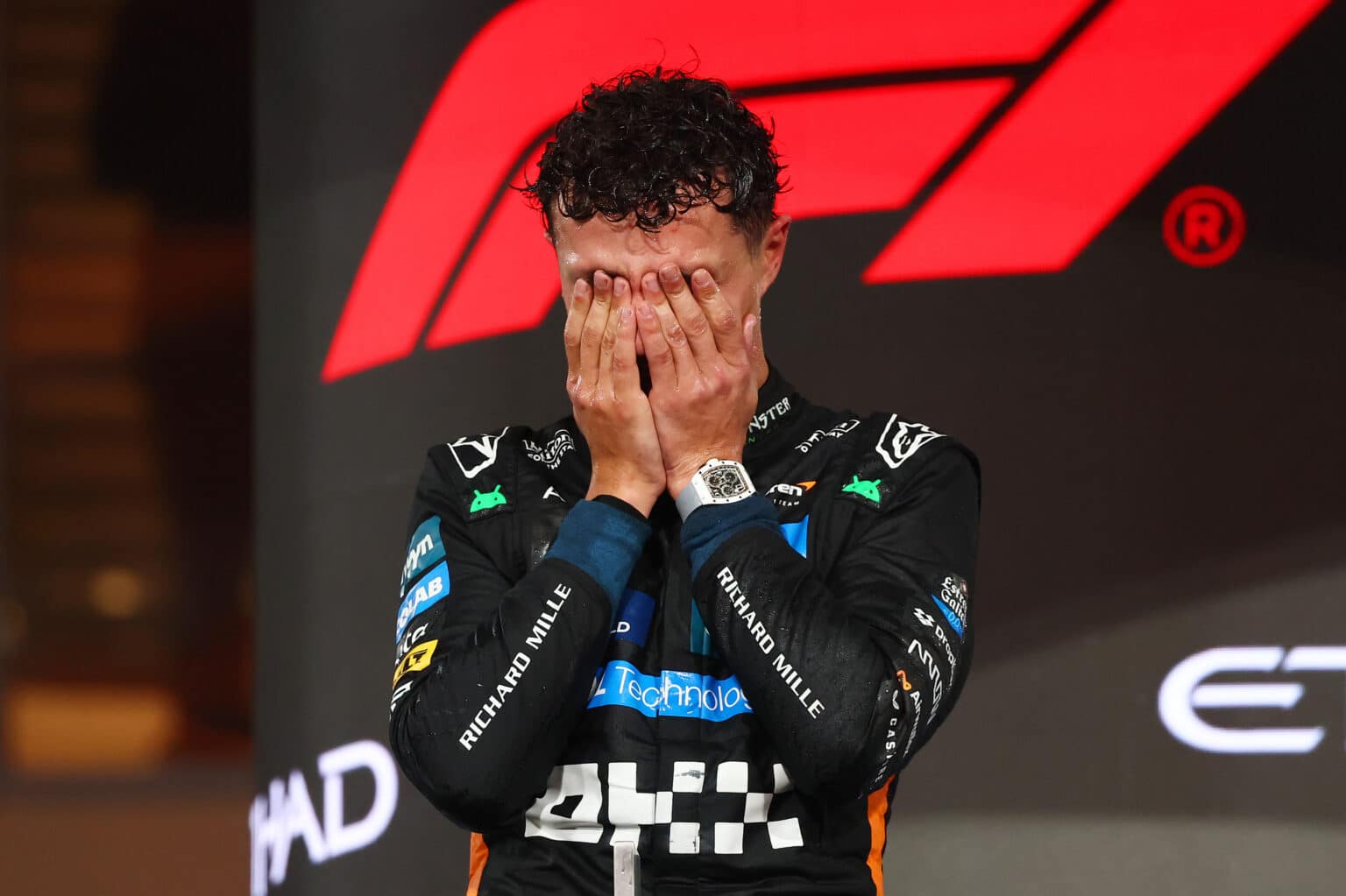 ABU DHABI, UNITED ARAB EMIRATES - DECEMBER 07: 2025 F1 World Drivers Champion and Third placed Lando Norris of Great Britain and McLaren celebrates on the podium during the F1 Grand Prix of Abu Dhabi at Yas Marina Circuit on December 07, 2025 in Abu Dhabi, United Arab Emirates. (Photo by Clive Rose/Getty Images)