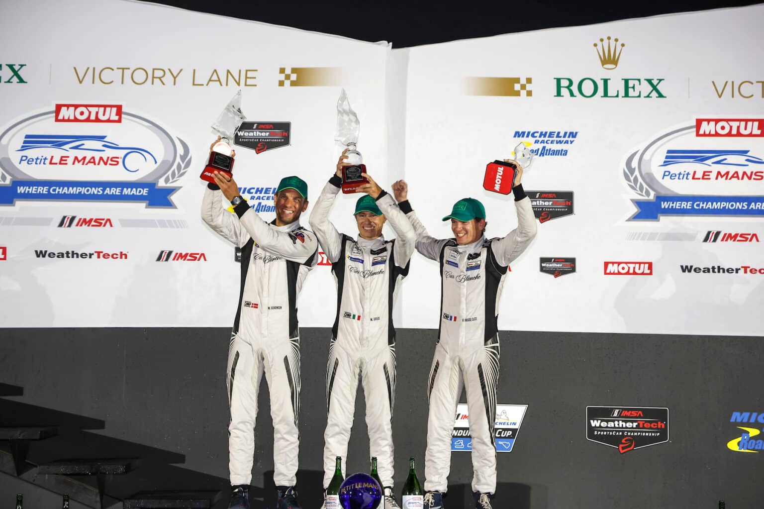 #68: Car Blanche, Aston Martin Vantage GT3 Evo, GTD Pro: Valentin Hasse Clot, Marco Sorensen, Mattia Drudi celebrate in victory lane